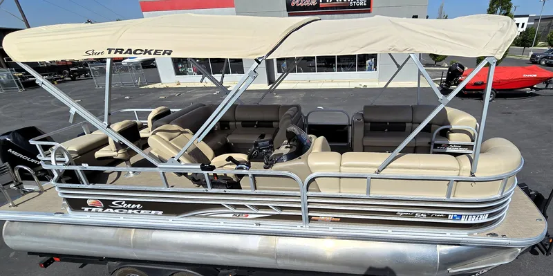 Slide: The Image of 2023 Sun Tracker SportFish 22 XP3 pontoon boat with beige canopy and seating. - 9