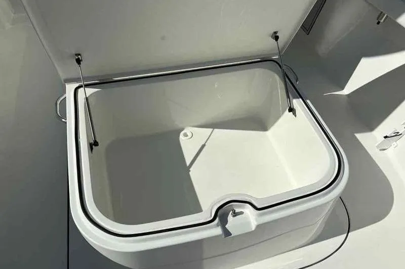 Slide: The Image of Open storage compartment on a 2026 Parker 2900 CC boat, showcasing interior space. - 19
