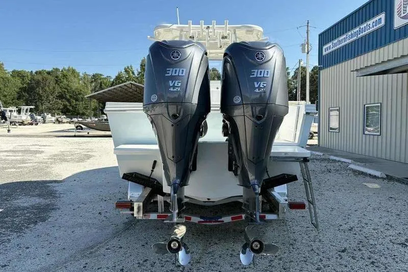 Slide: The Image of 2026 Parker 2900 CC boat with twin Yamaha 300 V6 outboard engines at a dealership. - 3