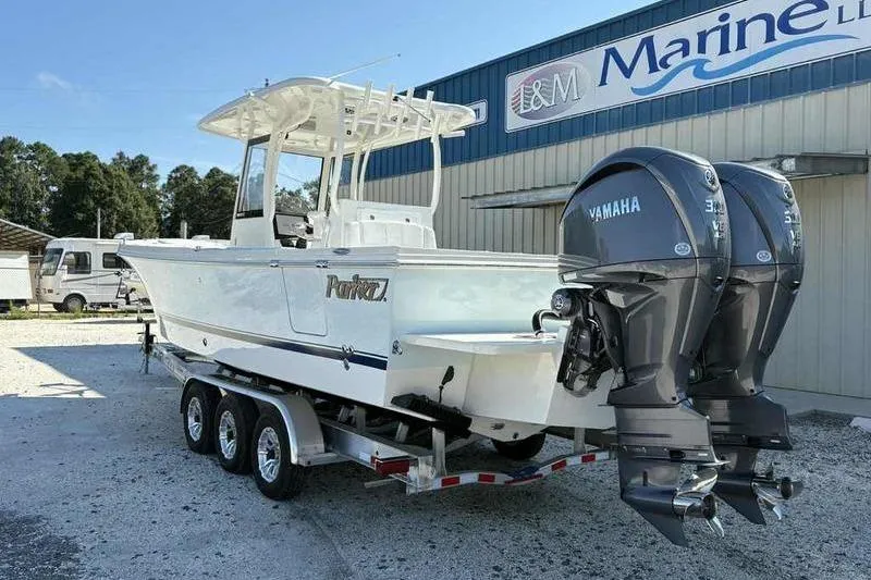 Slide: The Image of 2026 Parker 2900 CC boat with twin Yamaha engines on a trailer. - 4