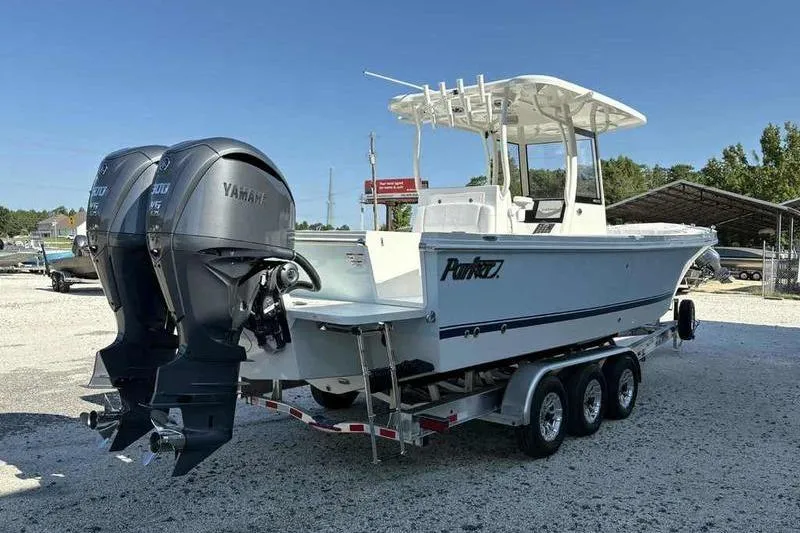 Slide: The Image of 2026 Parker 2900 CC boat on trailer with dual Yamaha outboard engines. - 5