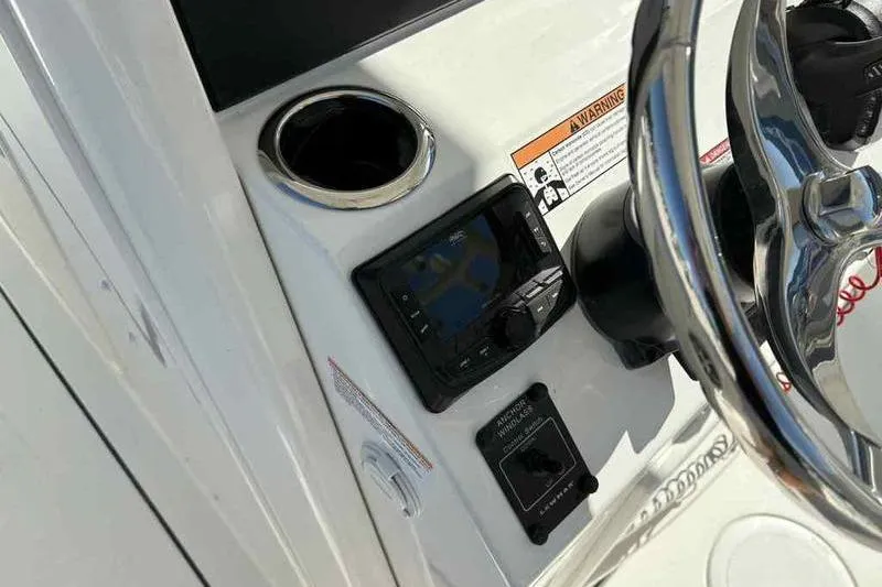 Slide: The Image of Control panel of 2026 Parker 2900 CC boat with steering wheel and cup holder. - 8