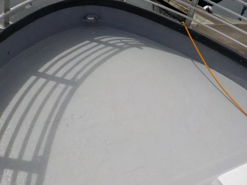 Slide: The Image of Top deck of a 1974 custom passenger vessel with railing shadow. - 14