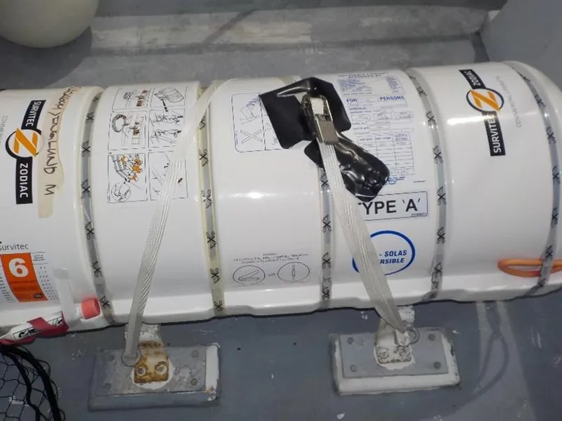 Slide: The Image of Liferaft container on a 1974 custom passenger vessel deck, secured with straps. - 15