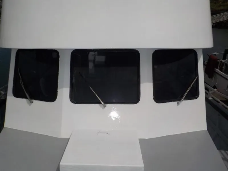 Slide: The Image of 1974 custom passenger vessel with three dark windows and wipers. - 4