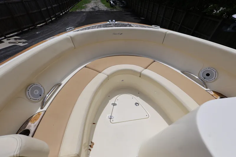Slide: The Image of 2020 Chris-Craft 30 Launch boat interior with beige seating and speakers. - 12