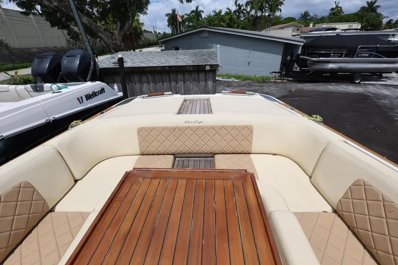 Slide: The Image of 2020 Chris-Craft 30 Launch boat with luxurious seating and wooden table. - 19