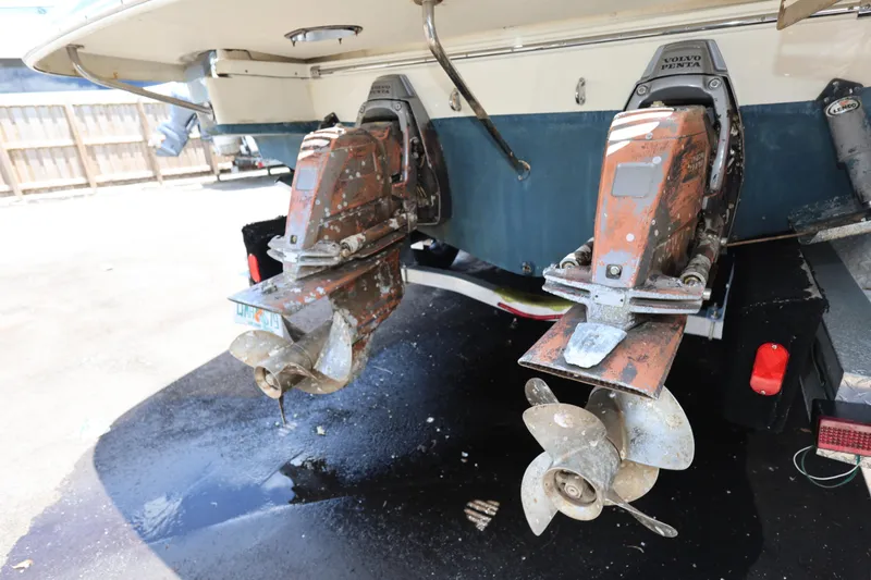 Slide: The Image of 2020 Chris-Craft 30 Launch boat with dual Volvo Penta outdrives, parked on a trailer. - 21