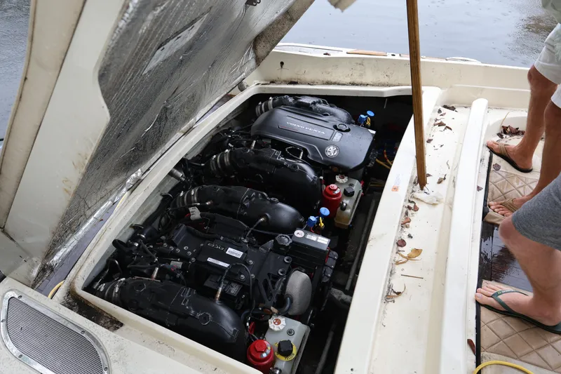 Slide: The Image of 2020 Chris-Craft 30 Launch engine compartment with open hatch, showing dual engines. - 24