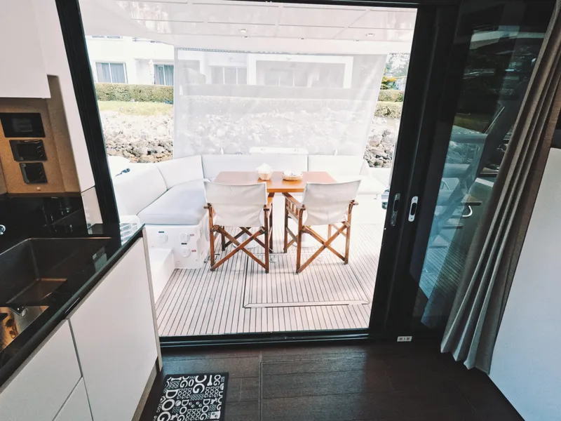 Slide: The Image of Interior view of 2020 Prestige 460 yacht with outdoor seating area. - 19