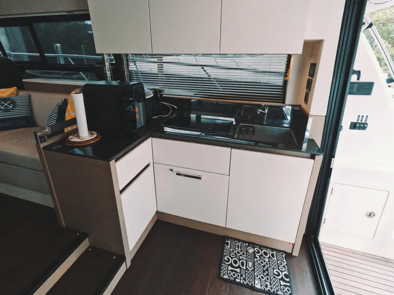 Slide: The Image of Modern kitchen interior on 2020 Prestige 460 yacht with sleek cabinetry and appliances. - 20