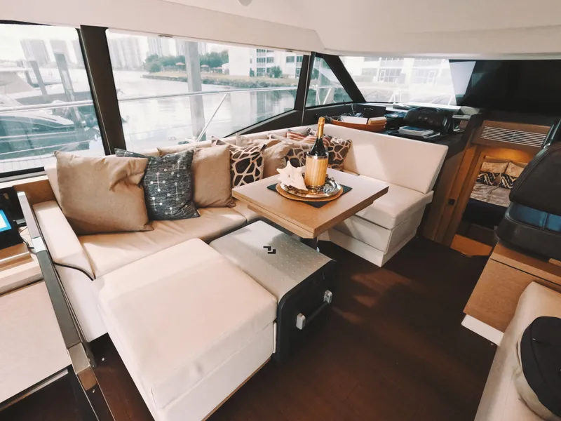 Slide: The Image of Luxurious interior of 2020 Prestige 460 yacht with elegant seating and champagne setup. - 23