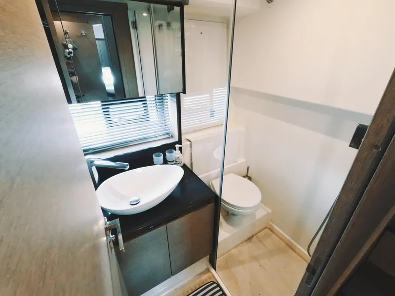 Slide: The Image of Modern bathroom in 2020 Prestige 460 yacht with sleek sink and toilet. - 32