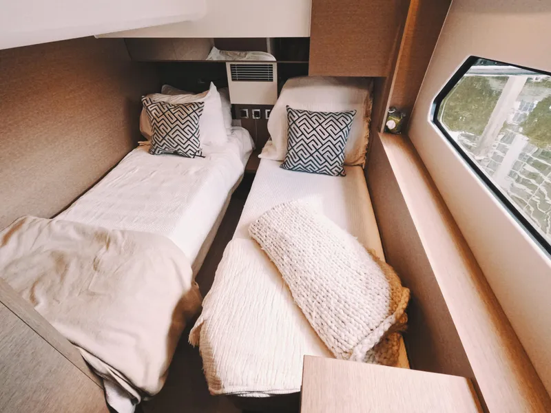 Slide: The Image of Cozy twin cabin in 2020 Prestige 460 yacht with modern decor and window view. - 34