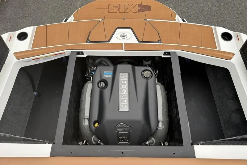 Slide: The Image of 2026 Axis A225 boat engine compartment with Monsoon engine, teak deck accents. - 14