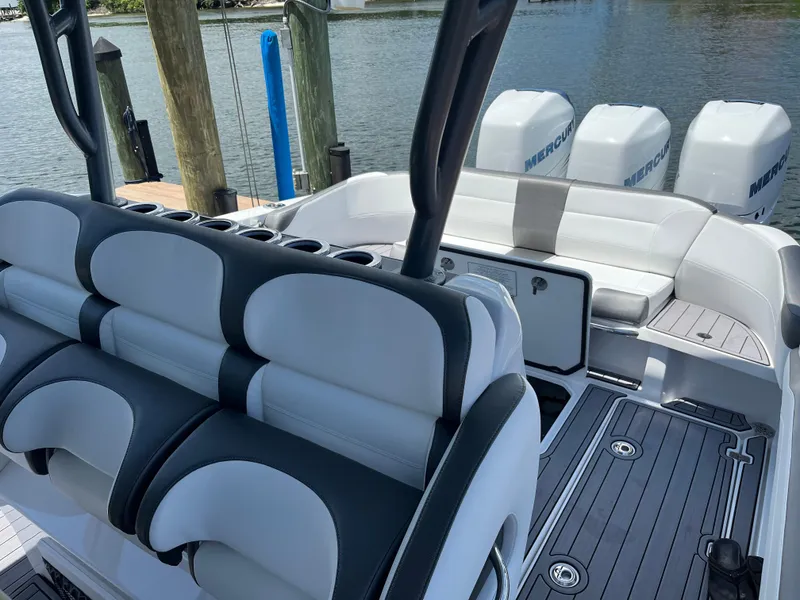 Slide: The Image of 2023 Nor-Tech 340 Sport Open Center Console with luxurious seating and powerful Mercury engines. - 4