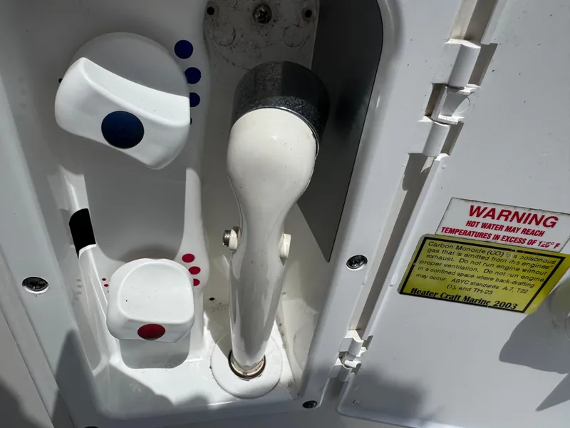 Slide: The Image of Control panel of a 2005 Sea Ray 320 Sundancer boat with warning label. - 10