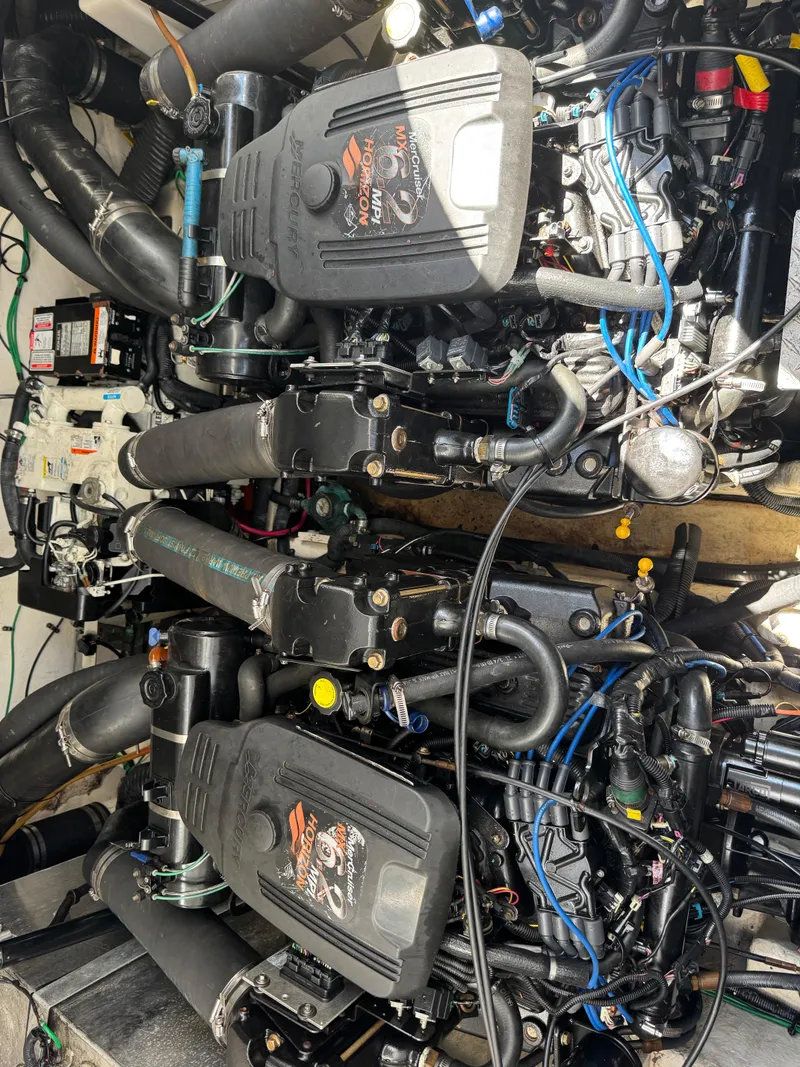 Slide: The Image of Engine compartment of a 2005 Sea Ray 320 Sundancer with twin inboard motors. - 19