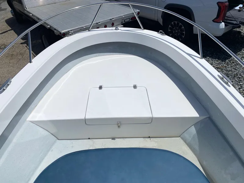Slide: The Image of Bow of a 1999 Maritime Skiff 20D boat with storage compartment. - 11