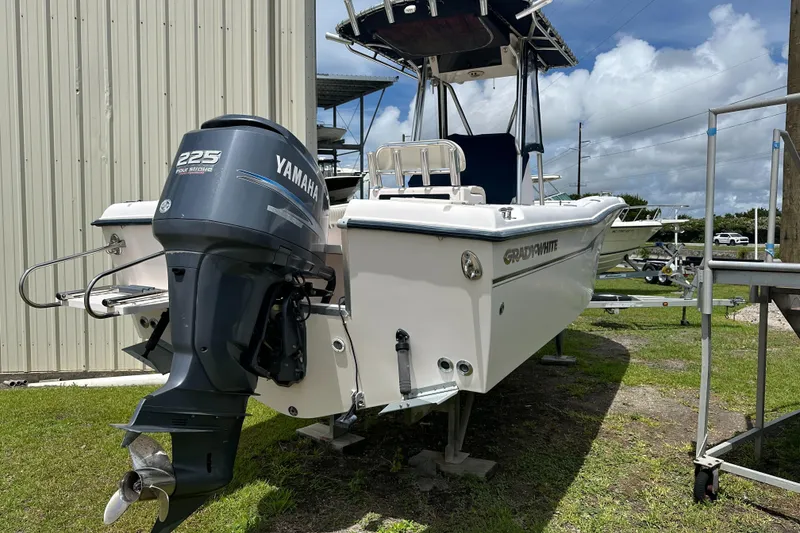 Slide: The Image of 2004 Grady-White Fisherman 222 boat with Yamaha 225 engine, parked outdoors. - 10