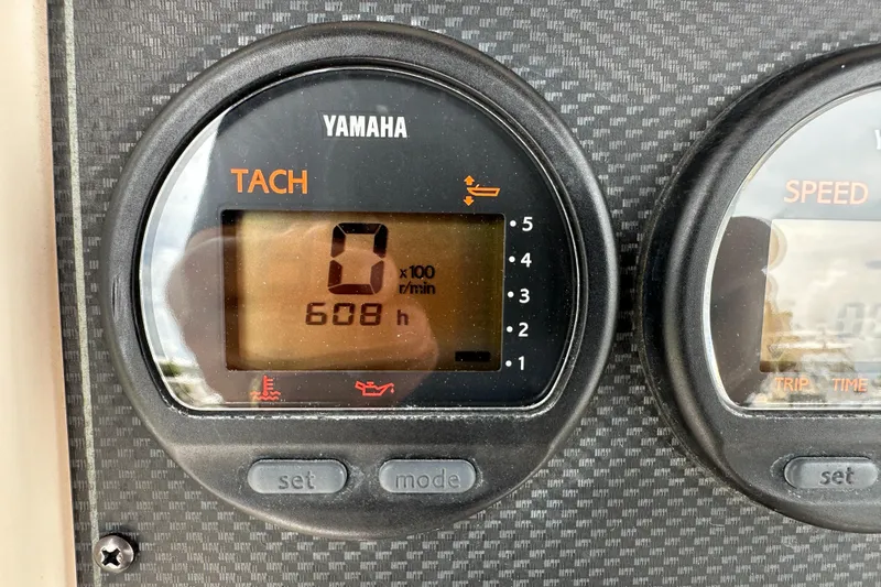 Slide: The Image of Yamaha tachometer displaying 608 hours on a Grady-White Fisherman 222, 2004 model. - 40