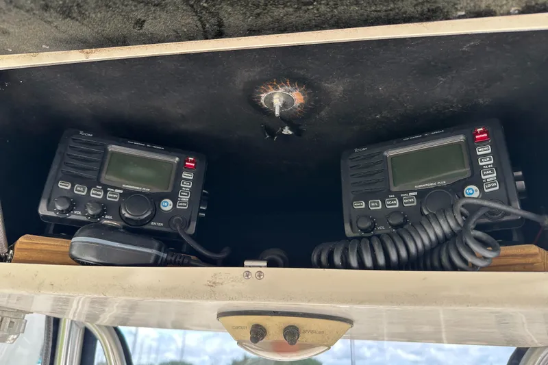 Slide: The Image of Dual marine radios in a 2004 Grady-White Fisherman 222 boat console. - 42