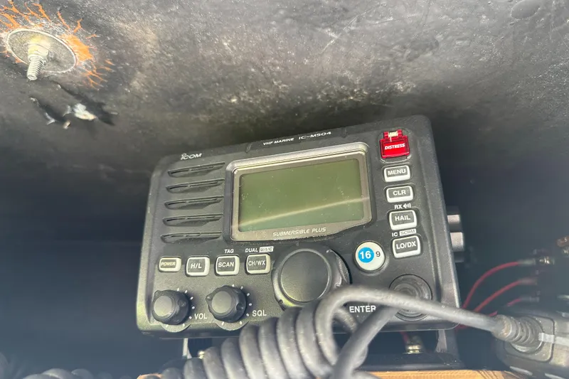 Slide: The Image of VHF marine radio on 2004 Grady-White Fisherman 222 boat dashboard. - 43