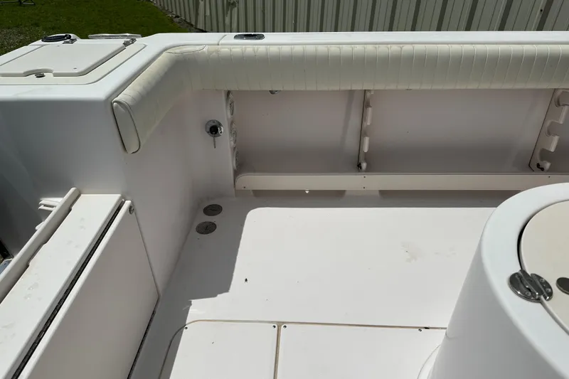 Slide: The Image of 2004 Grady-White Fisherman 222 boat interior, featuring seating and storage compartments. - 49