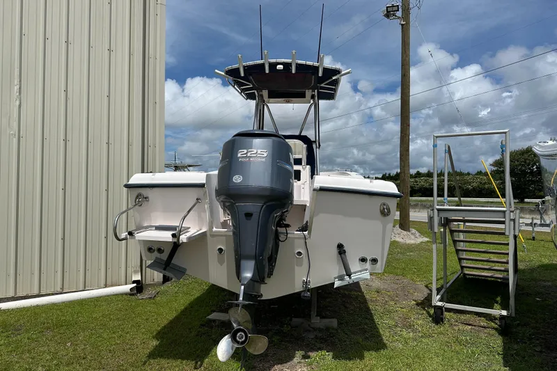 Slide: The Image of 2004 Grady-White Fisherman 222 boat with Yamaha 225 engine, parked outdoors. - 9