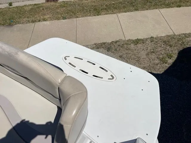 Slide: The Image of 1999 Four Winns 258 Vista boat interior with beige seating and white deck. - 6