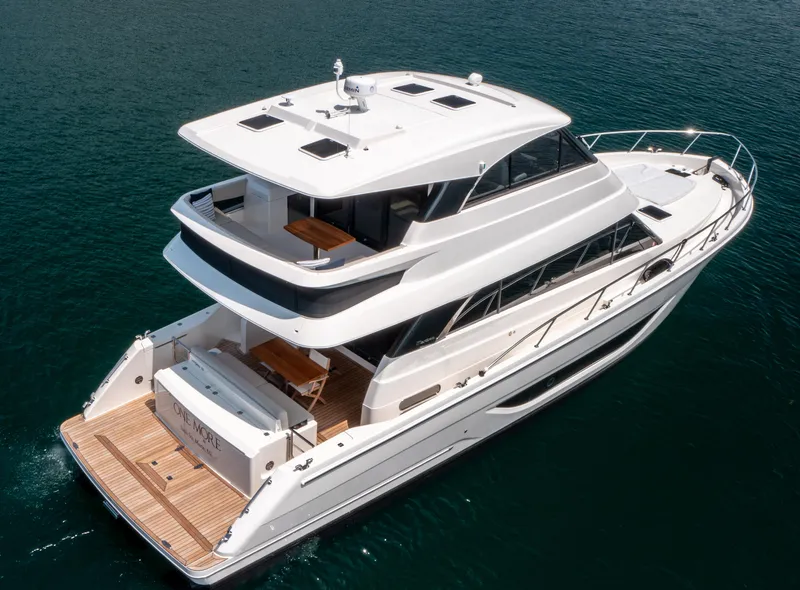 Slide: The Image of 2024 Maritimo M55 luxury yacht cruising on open water, showcasing sleek design and spacious decks. - 1