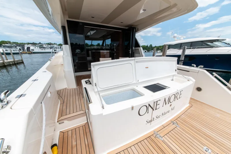 Slide: The Image of 2024 Maritimo M55 yacht with open deck, docked at marina. - 15