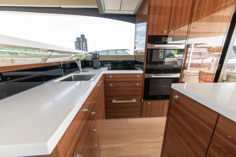 Slide: The Image of Luxurious kitchen interior of 2024 Maritimo M55 yacht with modern appliances and sleek design. - 22