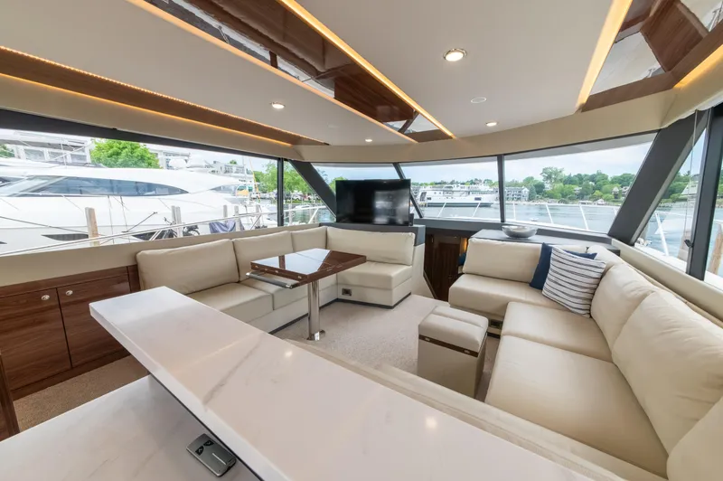 Slide: The Image of Luxurious interior of 2024 Maritimo M55 yacht with elegant seating and panoramic windows. - 25