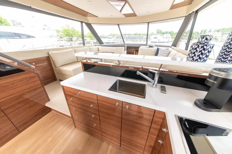 Slide: The Image of Luxurious interior of 2024 Maritimo M55 yacht with modern kitchen and seating area. - 26