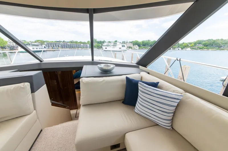 Slide: The Image of Luxurious interior of 2024 Maritimo M55 yacht with comfortable seating and scenic water view. - 30