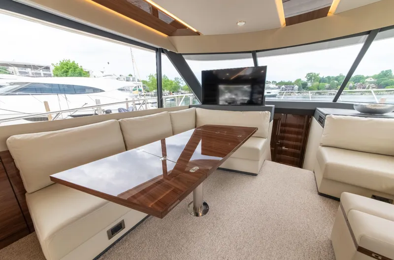 Slide: The Image of Luxurious interior of 2024 Maritimo M55 yacht with elegant seating and large windows. - 31