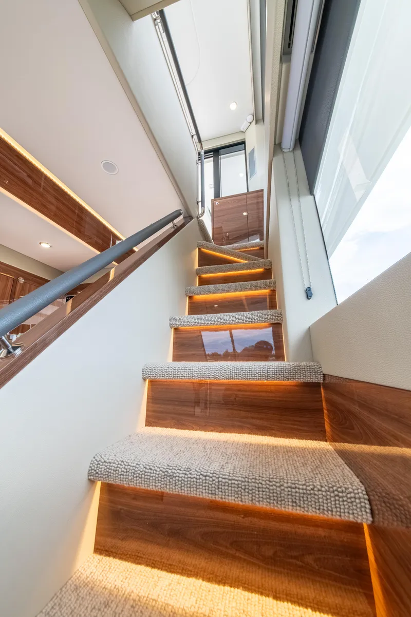 Slide: The Image of Staircase with ambient lighting in 2024 Maritimo M55 yacht interior. - 33