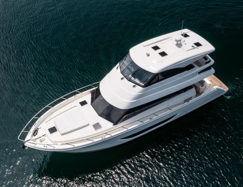 Slide: The Image of 2024 Maritimo M55 yacht on open water, aerial view. - 4