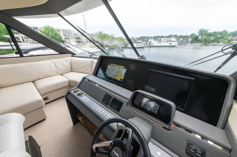 Slide: The Image of 2024 Maritimo M55 yacht interior with modern helm and navigation screens. - 40