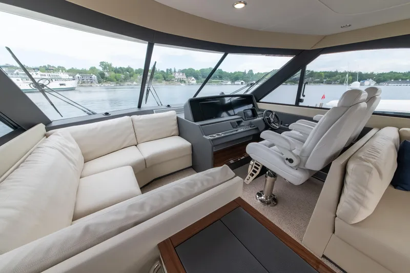 Slide: The Image of Luxurious interior of 2024 Maritimo M55 yacht with plush seating and panoramic windows. - 41