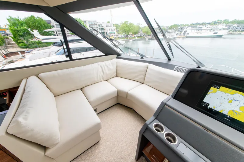 Slide: The Image of Luxurious interior of 2024 Maritimo M55 yacht with plush seating and navigation display. - 43