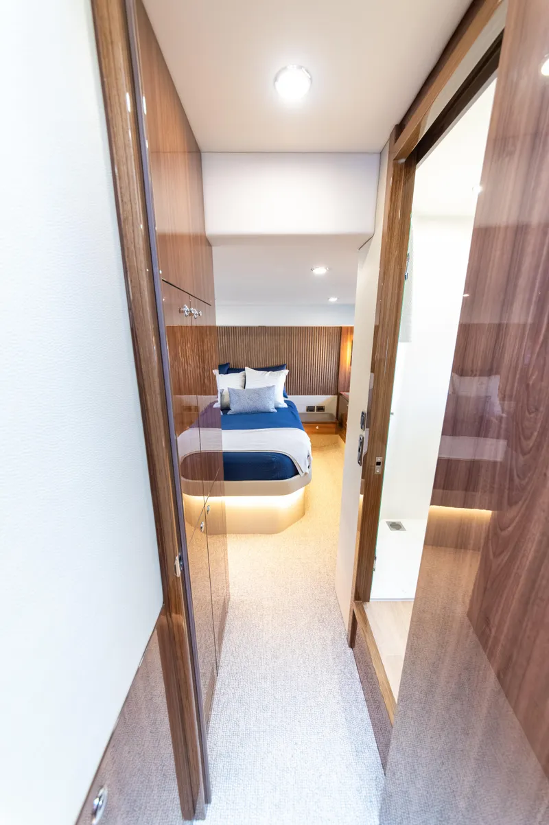 Slide: The Image of Luxurious cabin interior of 2024 Maritimo M55 yacht with modern design and cozy bedding. - 64