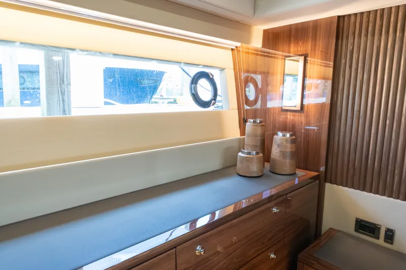 Slide: The Image of Luxurious interior of 2024 Maritimo M55 yacht with elegant wood finishes and modern decor. - 69