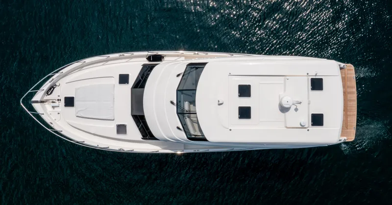 Slide: The Image of Aerial view of 2024 Maritimo M55 yacht on clear blue water. - 7