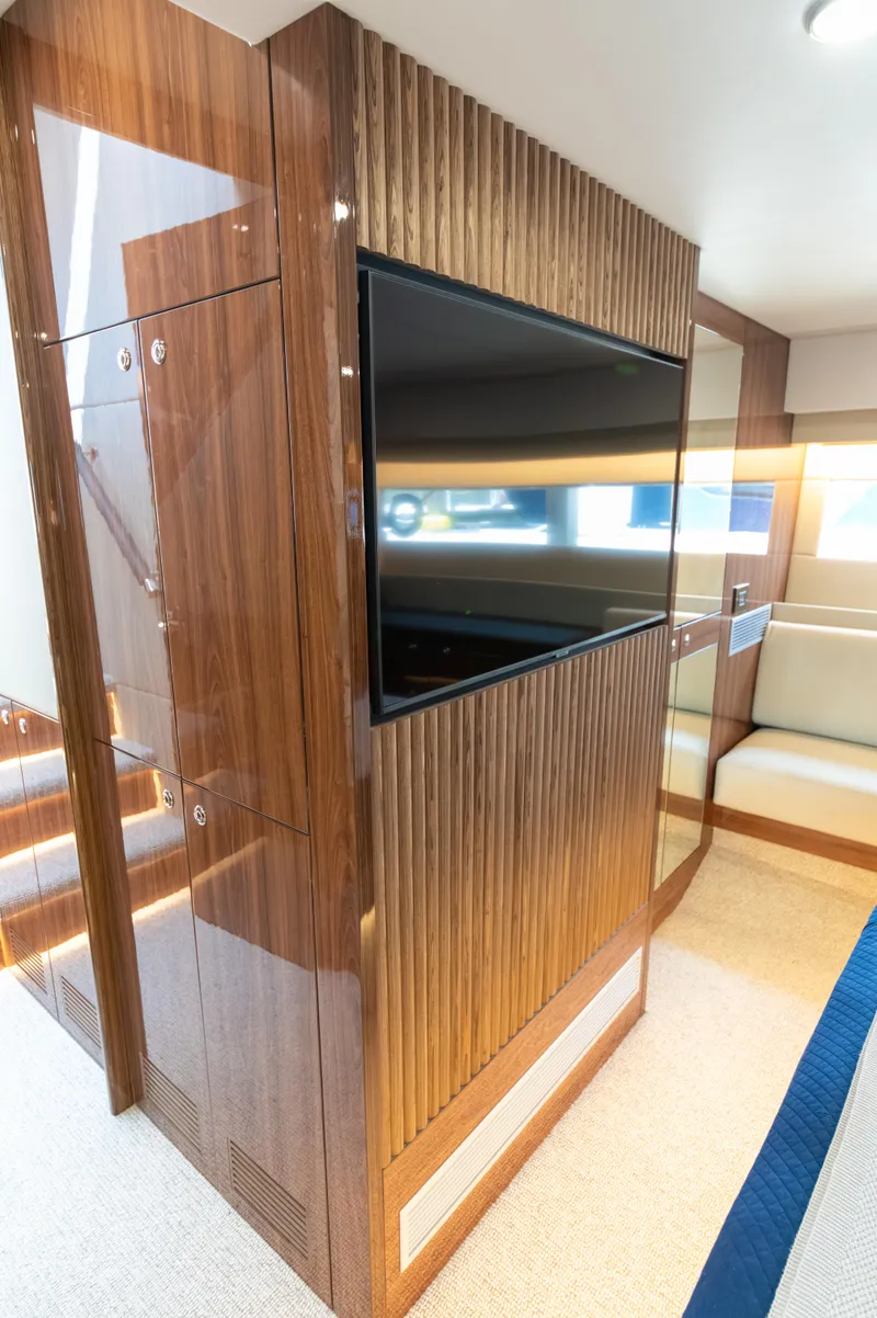 Slide: The Image of Luxurious interior of 2024 Maritimo M55 yacht with wood paneling and modern TV. - 70