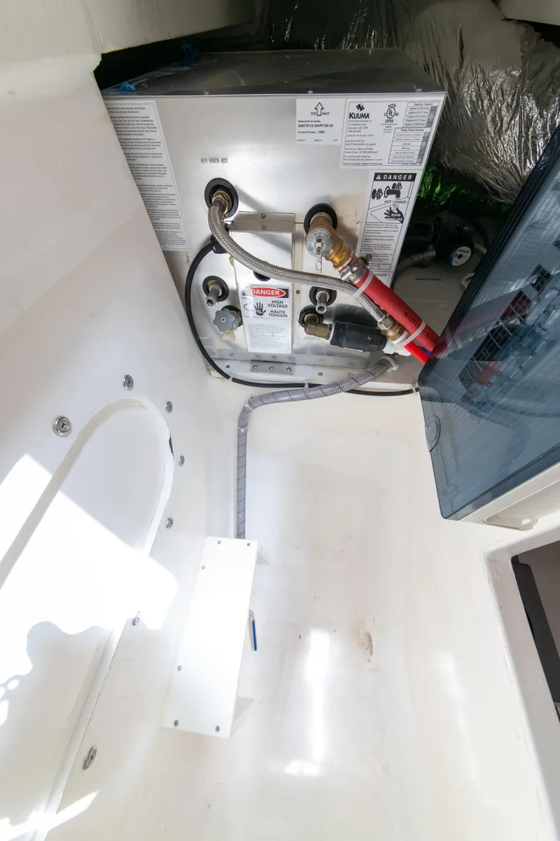 Slide: The Image of Engine compartment of 2024 Maritimo M55 yacht, showcasing mechanical components and wiring. - 81