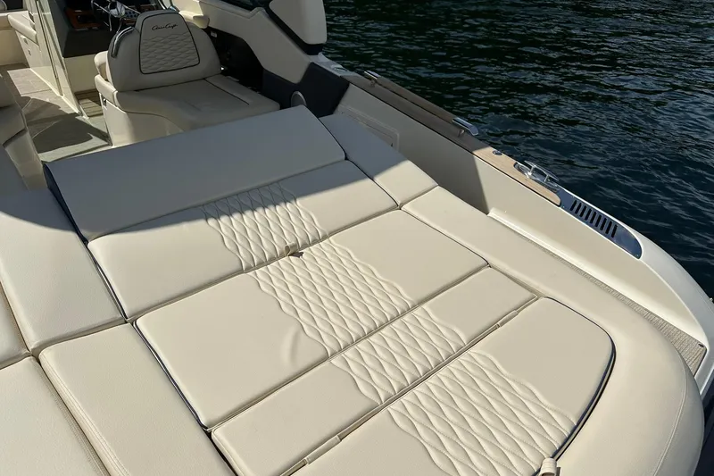 Slide: The Image of Luxurious seating on 2026 Chris-Craft Sportster 28 boat, featuring elegant beige upholstery. - 11