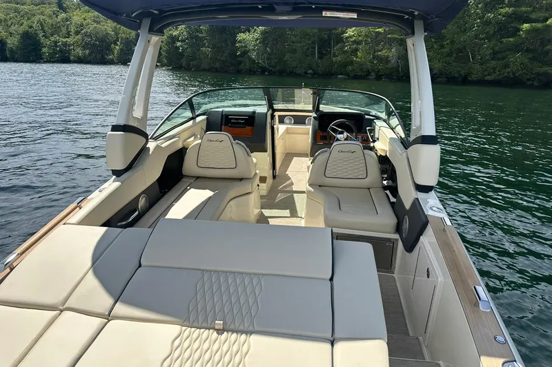 Slide: The Image of 2026 Chris-Craft Sportster 28 luxury boat interior on a serene lake. - 13