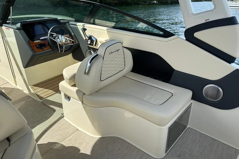 Slide: The Image of 2026 Chris-Craft Sportster 28 interior with luxurious seating and modern dashboard design. - 16